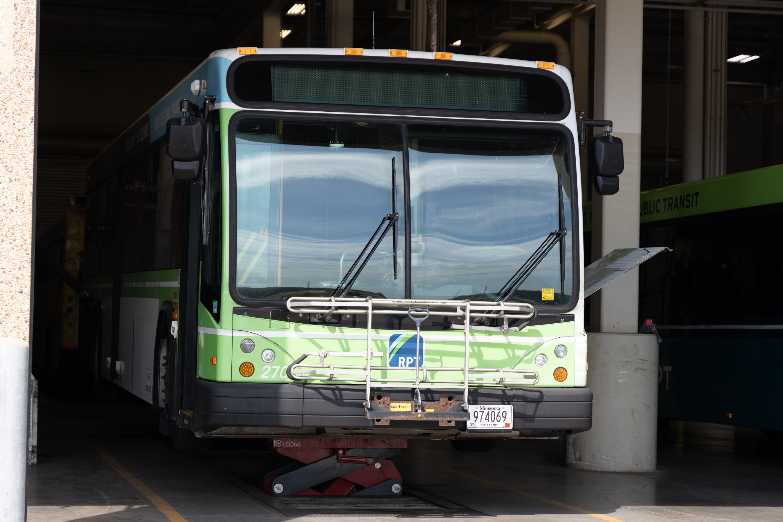 front end of an RPT bus parked in a garage