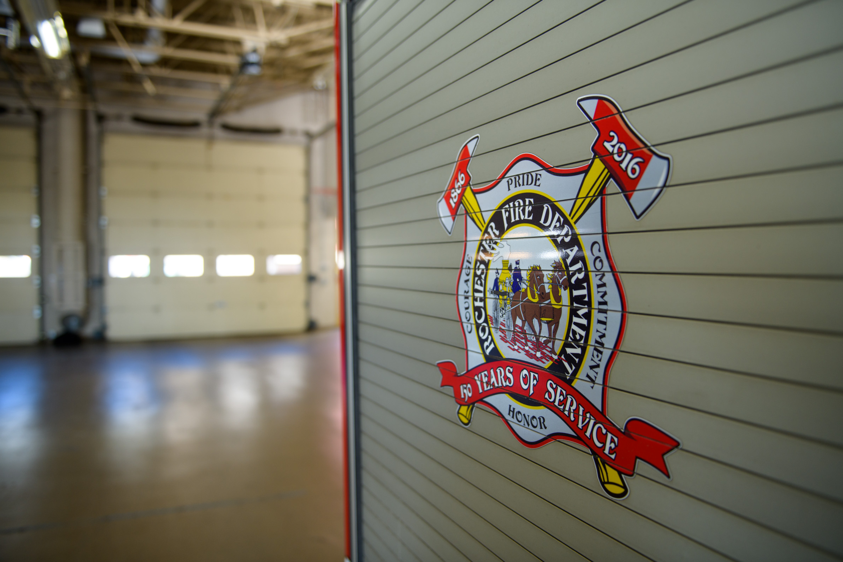 historic rochester fire department patch logo on a roll up door