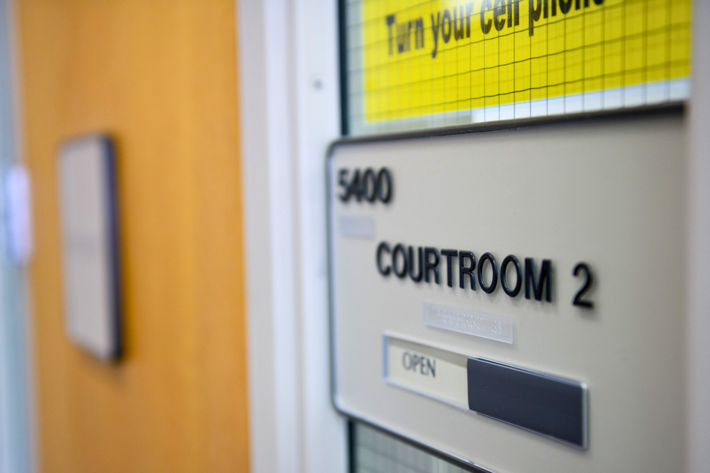 sign outside a doorway reading 'courtroom 2'