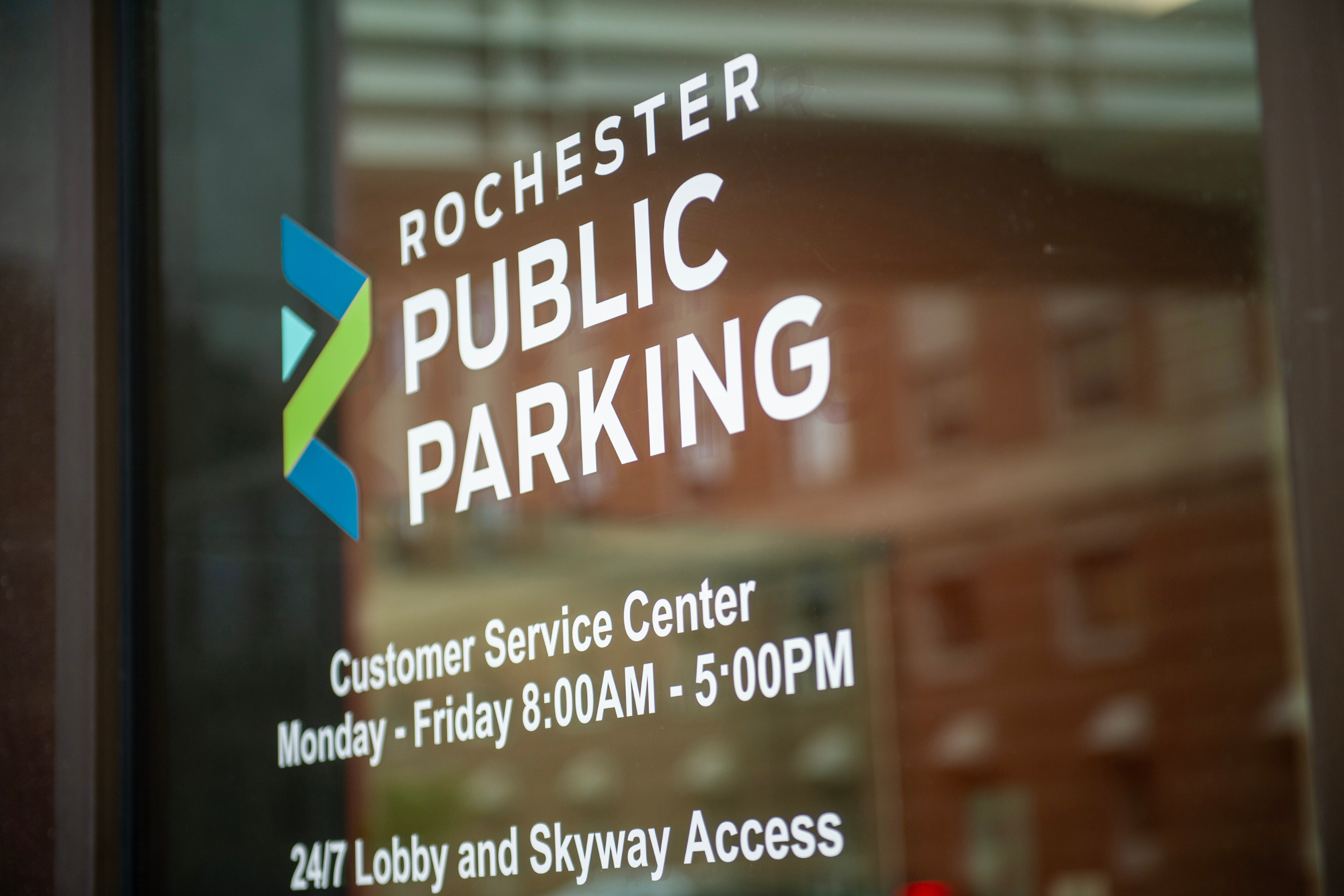 service window with rochester public parking logo